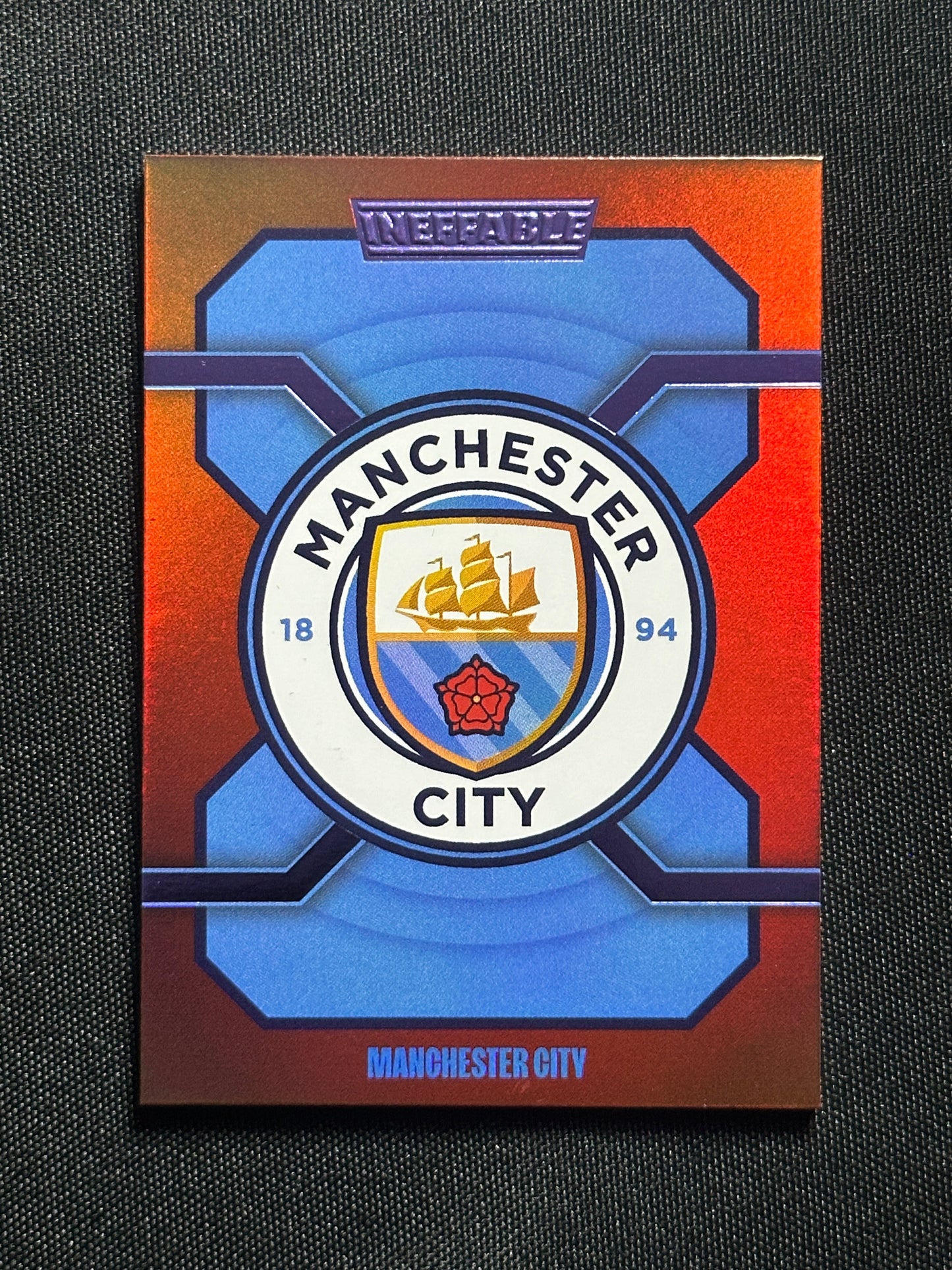 Badge Numbered Parallel 32/75 - Daka Manchester City Ineffable 2023/24