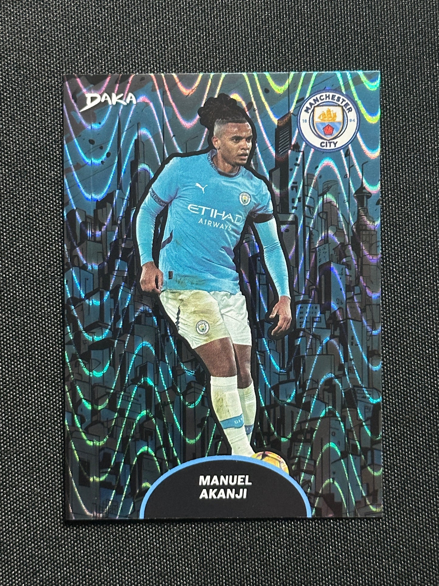 Manuel Akanji Numbered Parallel 147/149 - Daka Manchester City Top Audience 2024/25