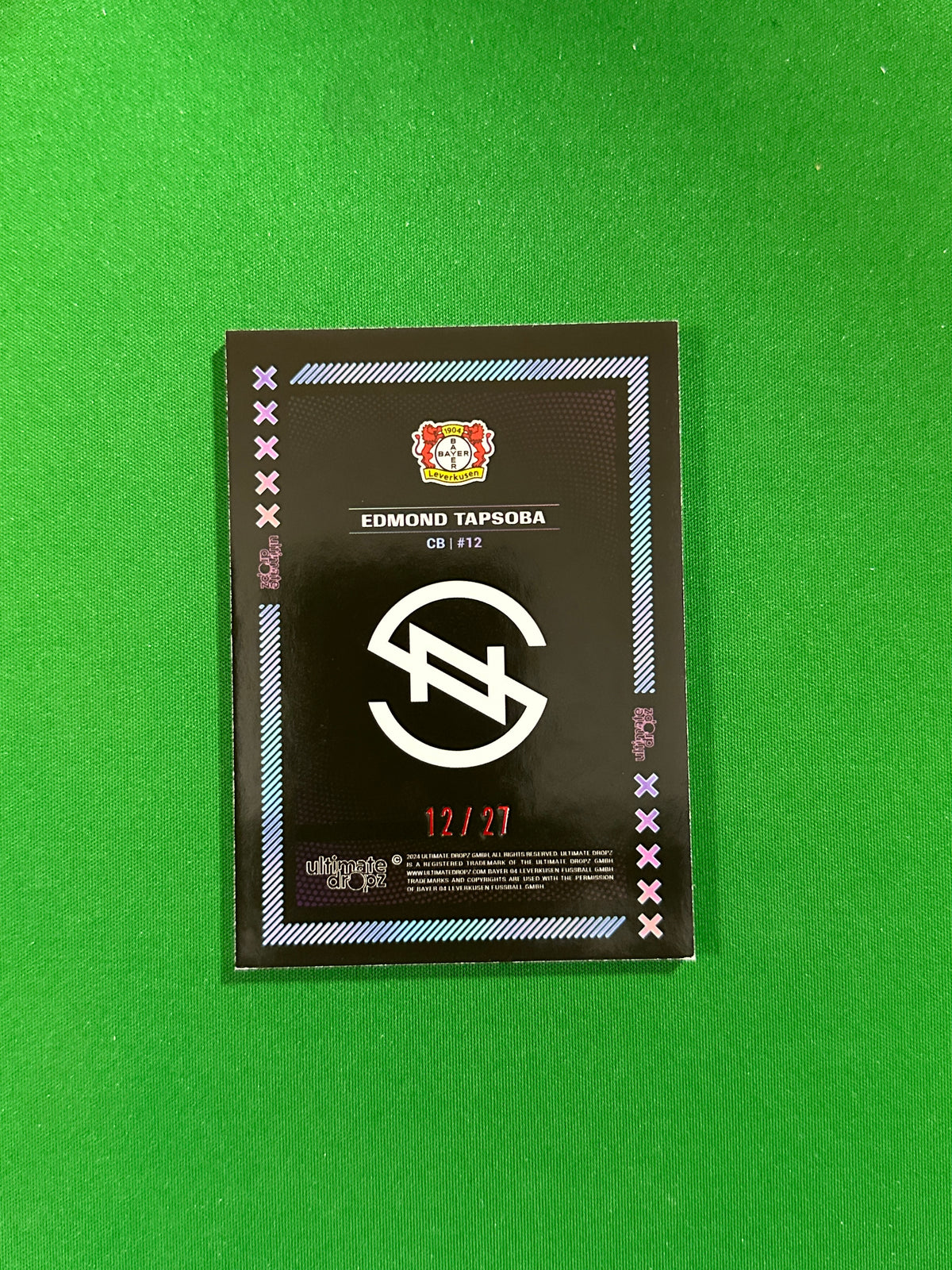 Edmond Tapsoba Numbered Parallel 12/27 - Ultimate Dropz Bayer 04 Leverkusen Supernova 2024 - back