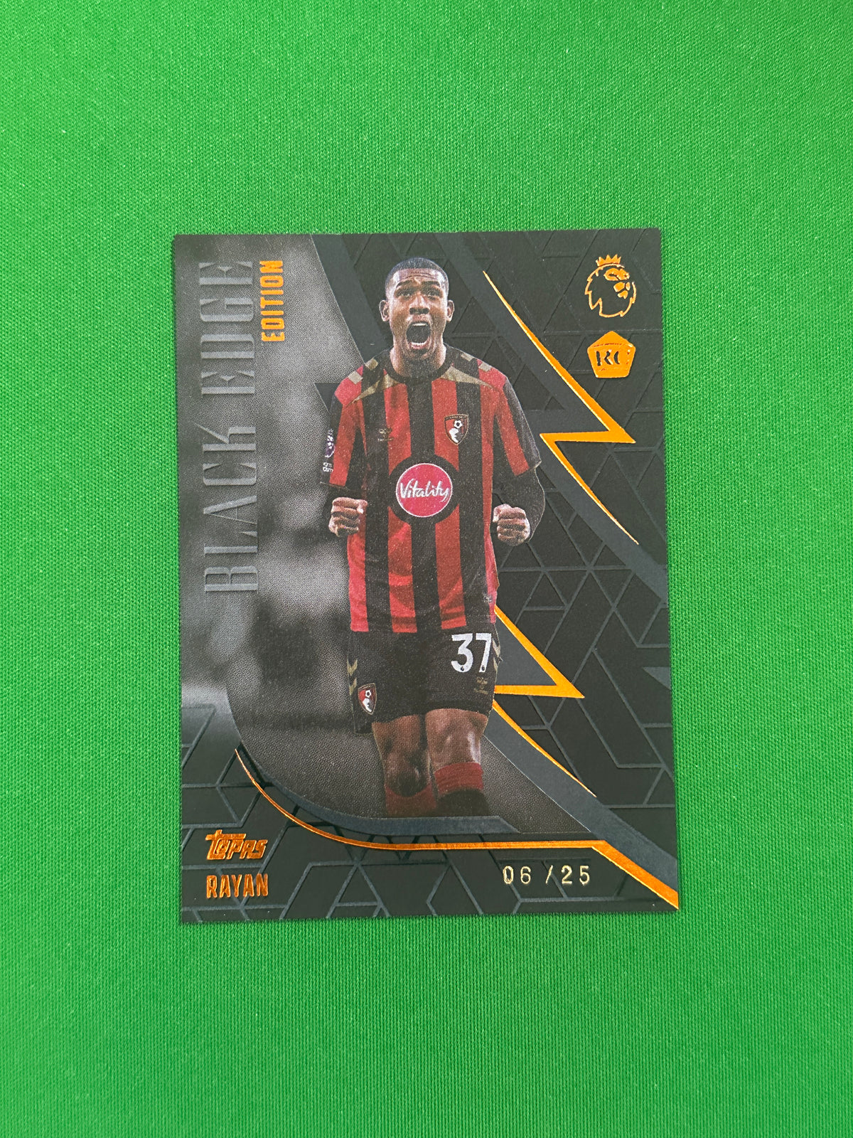 Rayan Black Edge Orange 06/25 — front