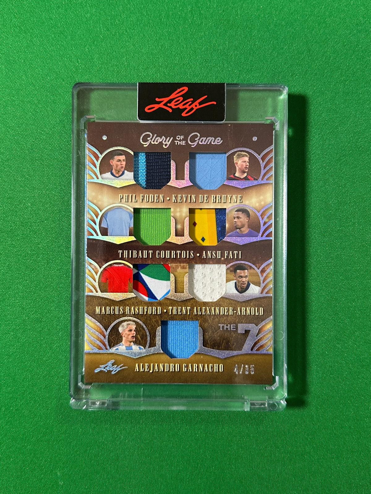 Phil Foden, Kevin De Bruyne, Thibaut Courtois, Ansu Fati, Marcus Rashford, Trent Alexander-Arnold & Alejandro Garnacho Relic 4/35 Leaf Glory of the Game 2026 football card Front