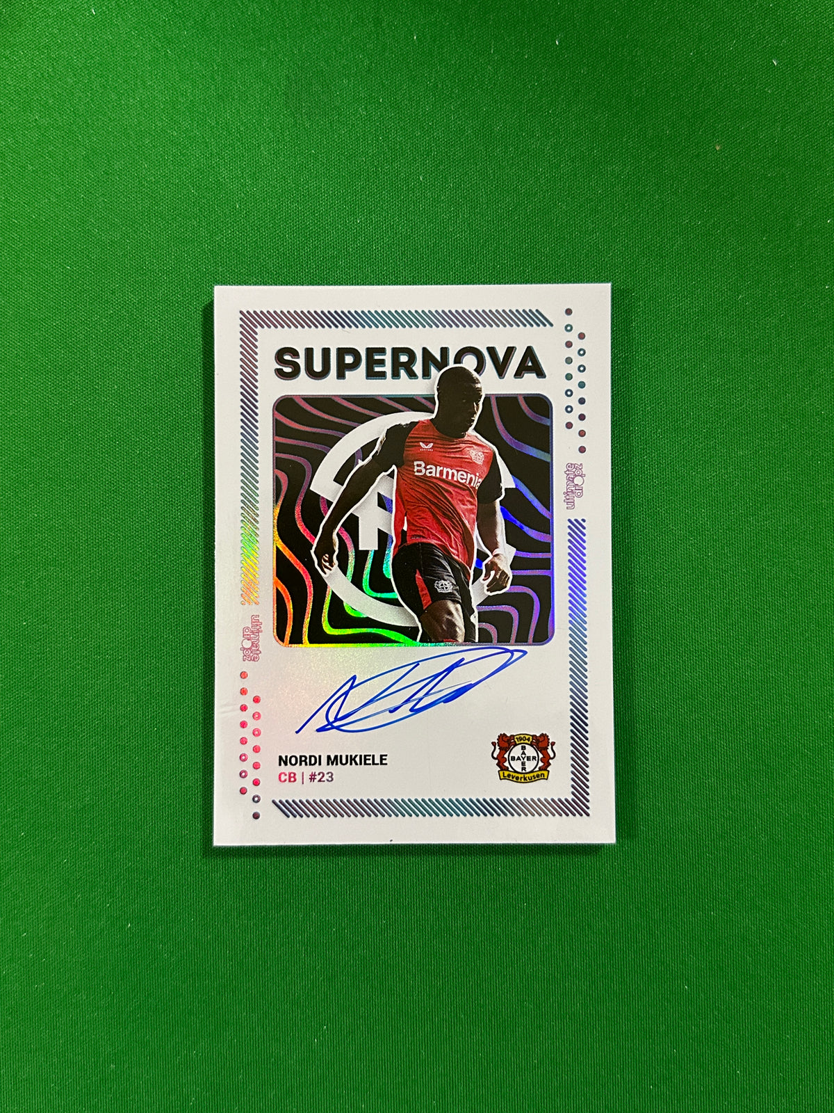 Nordi Mukiele On-card Autograph 16/26 - Ultimate Dropz Bayer 04 Leverkusen Supernova 2024 - front